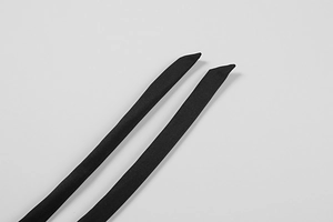 Detail shot of the black matte fabric ties with diagonal cut ends for women dress