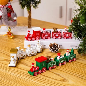 Wooden Christmas train set with festive snowman and bear figurines on table