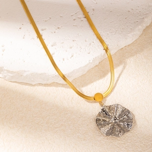 Modern two-tone stainless steel snake chain necklace with a wavy irregular pendant