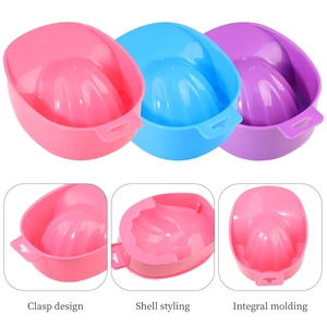 Detailed view of ergonomic manicure hand soak bowls with shell texture in pink and blue