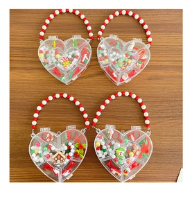 Detailed set of Christmas heart gift boxes with red hair clips and festive beads for kids