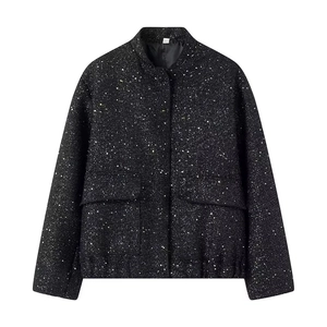 Detail of a black sequin jacket featuring a stand collar and large flap pockets