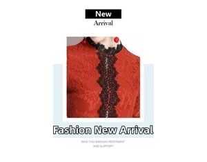 Detail of red lace dress showing intricate black lace embroidery and hollow neck craftsmanship