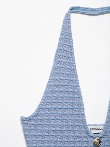 Close-up of light blue waffle knit halter dress featuring V-neck and metal button detail