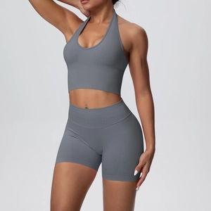 Detail view of seamless ribbed knit grey yoga set with halter top and high-waist shorts