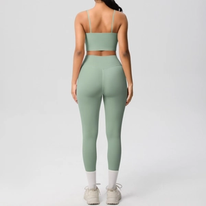 Detail of cross back yoga set with thin straps and high-waist leggings in bean green