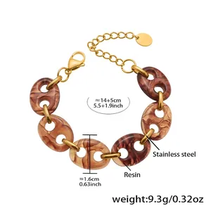 Detailed view of amber resin link bracelet with 18k gold plated stainless steel clasp