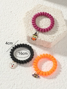 Three-pack of Halloween spiral hair ties with owl, ghost, and bat charms, 4cm diameter