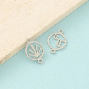 Macro view of mirror polished stainless steel hollow geometric charms for DIY jewelry