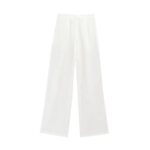 Detailed view of high-waisted white wide-leg trousers with clean minimalist straight cut
