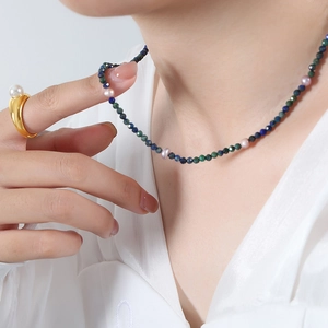 Handmade necklace with faceted phoenix lapis lazuli and natural freshwater pearls on model
