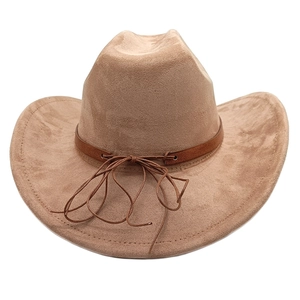 Detailed view of camel suede cowboy hat featuring dark brown leather band and bow knot