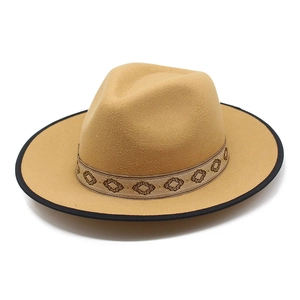 Classic camel wool jazz hat with geometric band and black trimmed brim on white background