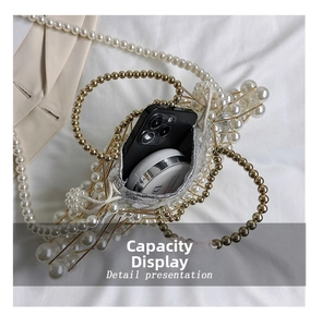 Detail presentation showing small pearl handbag capacity with smartphone and cosmetics