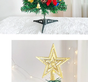 Detail of 50cm tabletop Christmas tree with gold star topper and festive ornaments