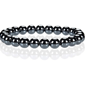 Detailed macro view of black hematite beads bracelet with reflective metallic surface
