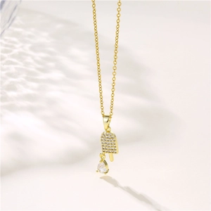 Golden ice cream pendant necklace with sparkling cubic zirconia on a dainty chain