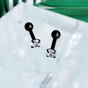 Detail of black four-claw stainless steel stud earrings with round clear zircon stones