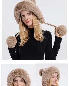 Detail of warm winter knit hat with large plush pom-poms and fleece lining in khaki