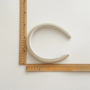 Detail view of thickened velvet headband with 3.5cm width measurement on scale
