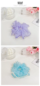 Detail of light purple and sky blue organza scrunchies with white pearl edge trim