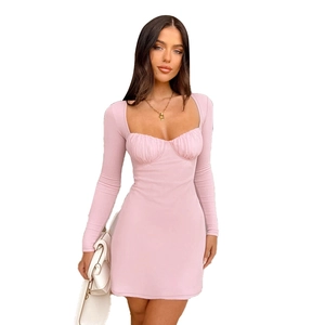 Pink long sleeve bodycon mini dress with ribbed knit texture and ruched chest design