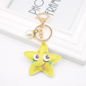 Yellow cartoon starfish leather keychain with smiling face and pearl charm accessory