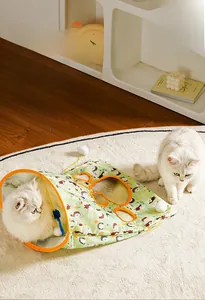 Detailed view of hedgehog printed cat tunnel with side entry holes and plush ball charm