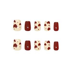 Handmade red heart press-on nails set in short square shape with white accent nails