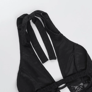 Close-up of black lace halter neck jumpsuit showing intricate mesh floral patterns