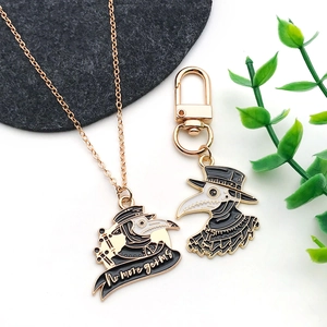 Detailed view of Plague Doctor pendant with 'no more germs' text on gold-toned chain