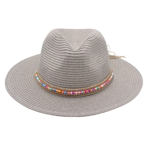 Close-up of grey Panama straw hat with colorful beads and hemp rope decorative band