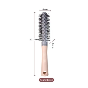 Detail of curling brush head with 4mm bristles and matte anti-slip handle for hair styling