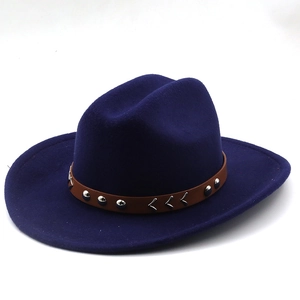 Close-up of a wool fedora hat with a brown leather band and metallic rivets