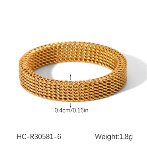 Detail view of 18k gold plated stainless steel ring with 0.4cm width and grid texture