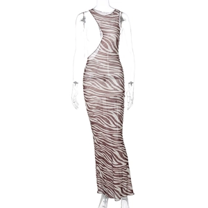 Close-up of zebra pattern sheer mesh dress featuring asymmetric cut-out and bodycon fit