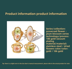 Macro detail of gold stainless steel rings with colorful dried flower resin inserts