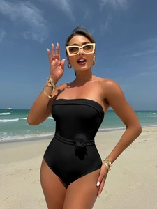 Black strapless one-piece swimsuit with 3D flower detail for beach vacation