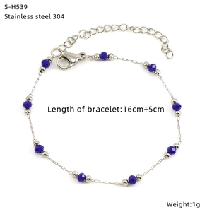 Detail view of titanium steel bracelet with blue glass beads and silver pearls