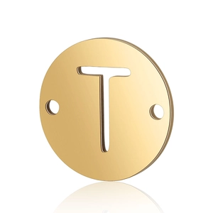 Detail view of a gold double-hole stainless steel pendant with a hollow letter T design
