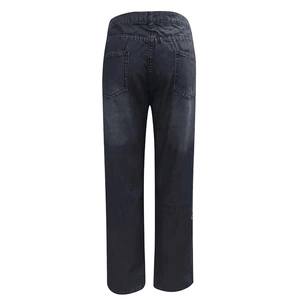 Rear view of stylish distressed dark gray denim pants with washed texture for women