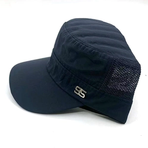 Detail of breathable mesh side panel and silver 95 metal emblem on navy flat top cap