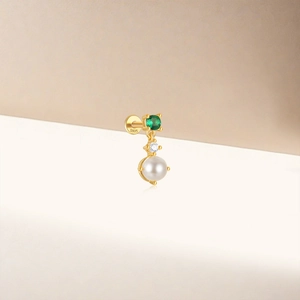Detail of S925 sterling silver ear stud with green gemstone and hanging pearl