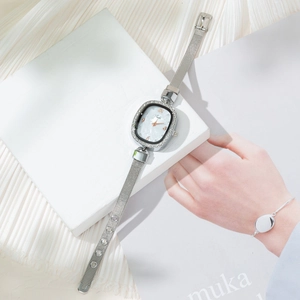 Silver quartz watch with diamond bezel, shell dial and stainless steel mesh strap