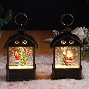Close-up of bronze Christmas water lanterns with LED light and automatic snow function