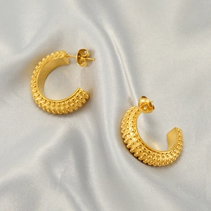 Elegant gold-plated stainless steel C-shaped earrings with textured granular surface finish