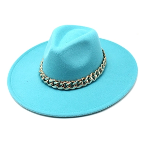 Close-up of bright blue wool fedora hat featuring a chunky gold metal chain detail