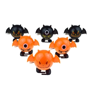 Set of six orange and black Halloween wind-up bat toys with various expressions