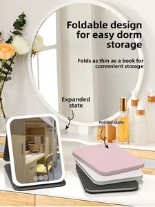Foldable LED makeup mirrors in pink, white and black shown on a vanity table