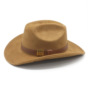 Detail of brown faux suede cowboy hat featuring leather band and gold metal accents